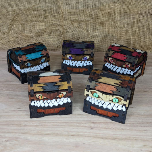 Set of handcrafted small mimic chests with colorful fantasy designs, ideal for gifts or tabletop storage.