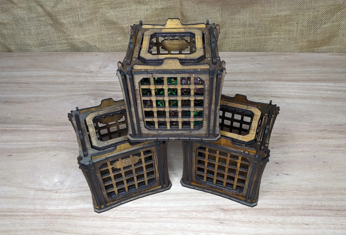 Wooden dice jails holding colourful polyhedral dice, novelty tabletop RPG accessories for naughty dice